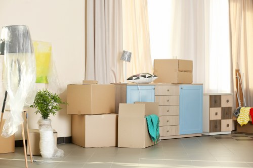 Moving boxes and wrapped furniture prepared for a Crystal Palace home relocation