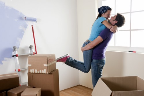 Professional movers handling furniture for a flat relocation