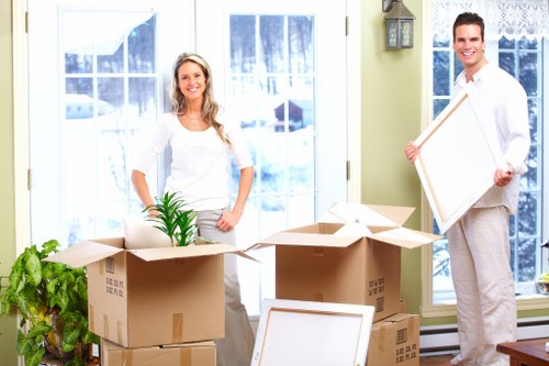 Professional office relocation team handling furniture in Crystalpalace